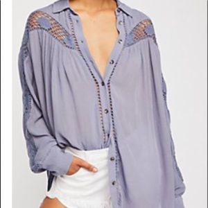 Guaze blouse by Free People. Deep denim blue color with cut out accents
